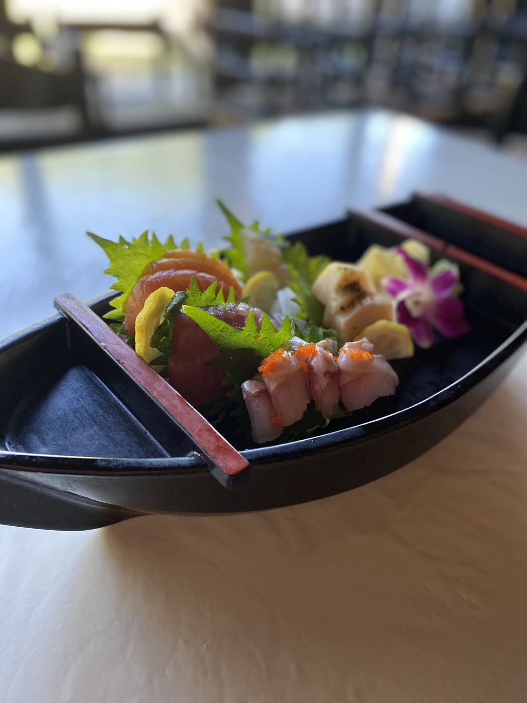 A wooden boat of assorted sashimi at Kogetsu